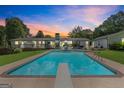 Backyard with a diving pool, patio and expansive yard perfect for entertaining or relaxing at 396 Ebenezer Rd, Fayetteville, GA 30215