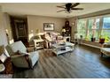Inviting living area with wood flooring, a large window, and comfortable seating at 4790 Hwy 101 N, Rockmart, GA 30153