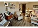 Comfortable living room with a cozy chair, decorative lamps, and wood-style flooring at 4790 Hwy 101 N, Rockmart, GA 30153