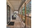 Inviting covered porch with outdoor seating, perfect for relaxing and enjoying the scenery at 4352 Treeline Way, Douglasville, GA 30135