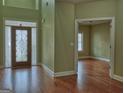 Bright foyer with hardwood flooring and a decorative glass front door at 834 Chalet Hills, Mcdonough, GA 30253