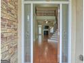 Spacious foyer with hardwood floors and an open view to the living area at 834 Chalet Hills, Mcdonough, GA 30253