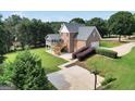 Scenic backyard featuring a deck, basketball court, and lush landscaping for outdoor enjoyment at 106 Big Cotton Trl, Mcdonough, GA 30252