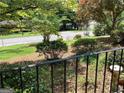 View of the front yard from the porch, showing a well maintained lawn and mature trees at 3746 Gladney Dr, Atlanta, GA 30341