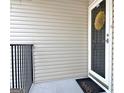 Condo front door with a wreath, mat, and white trim at 504 Ridgelake Dr, Peachtree City, GA 30269