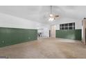 Spacious living room with neutral carpet, wainscoting and ample natural light at 1120 Rawlings Dr, Rutledge, GA 30663