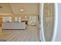Spacious living room with a fireplace, vaulted ceiling, and lots of natural light at 155 Westminister Village Blvd, Sharpsburg, GA 30277