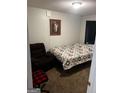 Cozy bedroom featuring a comfortable bed, recliner, and decorative artwork at 3523 Lehigh Way, Decatur, GA 30034