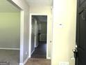 Inviting entryway with neutral walls and flooring, offering a glimpse into the home's interior at 3589 Burlingham Dr, Lithonia, GA 30038
