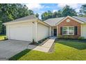 A charming single-Gathering home featuring an attached two car garage and a well-maintained front lawn at 315 Antioch Road, Mcdonough, GA 30252