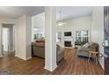 Spacious living room with wood floors, fireplace, high ceiling, and large windows allowing natural light at 315 Antioch Road, Mcdonough, GA 30252