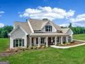 Beautiful single-Gathering home with a light brick exterior and a spacious, covered front porch at 357 Old Driver Rd, Whitesburg, GA 30185