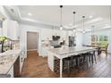 Modern kitchen with white cabinets, granite countertops, and stainless steel appliances at 357 Old Driver Rd, Whitesburg, GA 30185