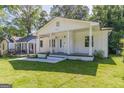 Beautifully maintained home with a welcoming front porch and pristine landscaping at 1446 Westmont Sw Rd, Atlanta, GA 30311