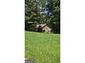 Spacious backyard with well-maintained grass, perfect for outdoor activities at 1448 Se Hillside Place, Conyers, GA 30094