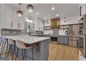 Bright kitchen with white cabinets, quartz countertops, and stainless steel appliances at 425 Birkdale Dr, Fayetteville, GA 30215