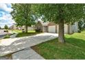 Exterior shot of a brick home with a two-car garage and spacious front yard at 1735 Deer Crossing Cir, Jonesboro, GA 30236