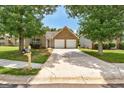 Well-maintained brick home featuring a two-car garage and driveway at 1735 Deer Crossing Cir, Jonesboro, GA 30236