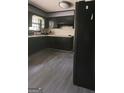 Modern kitchen featuring sleek black cabinetry and updated appliances at 491 Allana Ct, Stone Mountain, GA 30087