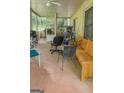 Enclosed patio area with seating and outdoor equipment at 491 Allana Ct, Stone Mountain, GA 30087