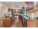 Gourmet kitchen featuring stainless steel appliances, granite countertops, and custom cabinetry at 1484 Mcpherson Se Ave, Atlanta, GA 30316