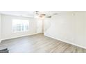 Bright, open living room featuring new hard surface floors, neutral paint, and a ceiling fan at 2655 Virginia Cv, Riverdale, GA 30296