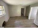 Bedroom showcasing bare walls, new floors and a window with natural light at 2138 Rachael Se St, Atlanta, GA 30315