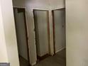 Hallway with bare walls and open doors leading to storage spaces at 2138 Rachael Se St, Atlanta, GA 30315