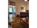 Cozy living room featuring a comfortable leather sofa and wood flooring at 259 Independence Dr, Jonesboro, GA 30238