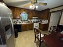 Traditional kitchen featuring wood cabinets and stainless steel appliances at 4355 Hambrick Pl, Stone Mountain, GA 30083