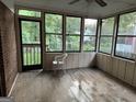 Bright sunroom with multiple windows offering serene backyard views at 4355 Hambrick Pl, Stone Mountain, GA 30083