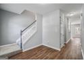 Welcoming foyer with hardwood flooring and a staircase leading to the upper level at 2203 Hyssop Way, Buford, GA 30519