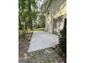 A concrete patio extends from the house, offering an outdoor space with room for seating and relaxation at 4688 Brice Dr, Union City, GA 30291