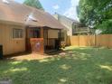 Large backyard featuring a covered patio area, perfect for outdoor relaxation and entertaining at 3232 Deer Pause Ln, Decatur, GA 30034