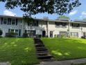 Inviting townhouses with grassy lawns and steps leading to front doors, perfect for community living at 412 Sycamore Dr # D, Decatur, GA 30030