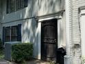 Charming townhouse showcasing a beautifully ornamented front door and well-maintained surroundings at 412 Sycamore Dr # D, Decatur, GA 30030