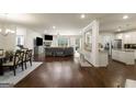 Spacious open-plan living area boasts hardwood floors and modern finishes at 845 Graeme Dr, Mcdonough, GA 30252