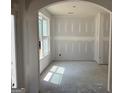 Inviting room showcasing natural light through a large window, creating a warm atmosphere at 5565 Hwy 155, Stockbridge, GA 30281