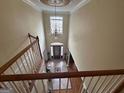 Elegant foyer with high ceilings, a chandelier, and a grand staircase at 145 Mill Run, Fayetteville, GA 30214