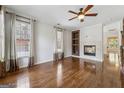 Cozy living room with hardwood floors, fireplace, and recessed shelves for a comfortable ambiance at 1278 Discover Green Lane Ln # 7, Mableton, GA 30126