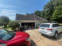 Spacious two-car garage with ample parking space on a sunny day at 733 Stonehaven Chase, Mcdonough, GA 30253