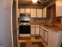 Kitchen with white cabinets, light-toned countertops and a decorative backsplash at 2498 Robinhood Dr, Ellenwood, GA 30294
