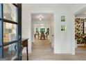 Bright foyer featuring hardwood floors, shiplap walls and an open view to the dining area at 591 Clubwood Ct, Marietta, GA 30068