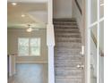 Bright entryway featuring staircase, wood floors, and natural light through a large window at 4434 Eastbrook Pl # 59A, Snellville, GA 30039