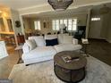 Open living room with modern decor, hardwood floors, and bright lighting at 276 Colewood Nw Way, Atlanta, GA 30328