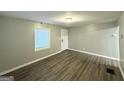 Inviting living room with modern flooring, neutral walls, and bright window at 3645 Croft Nw Pl, Atlanta, GA 30331