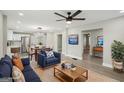 Open-concept living and dining area with modern light fixture, hardwood floors and neutral color palette at 1515 Jonesboro Se Rd, Atlanta, GA 30315