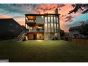 Large backyard featuring a two-story deck with a walkout basement at 6665 Flagstone Ct # 918, Cumming, GA 30028