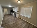 Modern kitchen with white cabinets, stainless steel appliances, and granite countertops at 4329 Parkview Dr, Lithia Springs, GA 30122