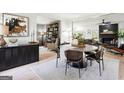 Open-concept dining area with modern furnishings and lots of natural light at 109 Old Virginia Cir, Jonesboro, GA 30236